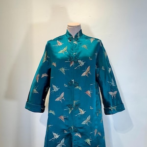 May include: A set of three ceramic mugs with a speckled, matte finish. The mugs are in shades of cream, light gray, and dark gray. Each mug has a simple, minimalist design, perfect for coffee or tea.