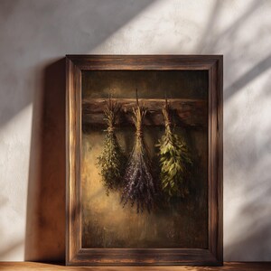 A moody oil painting of three tied bundles of dried herbs hanging from a wooden beam against a textured umber background.