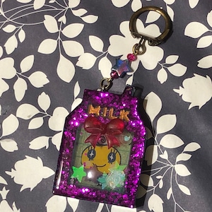 Purple Tamagotchi Memetchi milk shaker keychain (Glows in the dark)