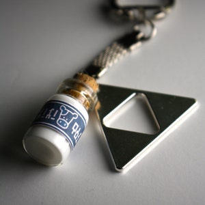 Legend of Zelda Lon Lon Milk and Triforce pendant Keychain (Glows in the dark!)