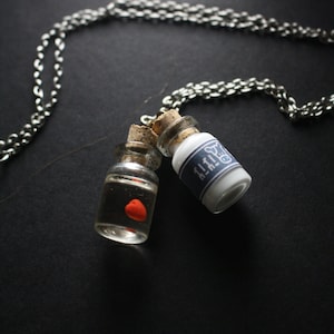 Legend of Zelda Lon Lon milk and heart in a bottle Necklace (Glows in the dark!)