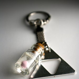 Legend of Zelda Fairy in a bottle (Glows in the dark) and triforce Keychain