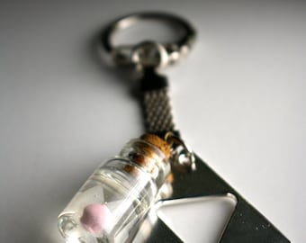 Leyenda del Hada Zelda en una botella (Brilla en la oscuridad) y llavero triforce