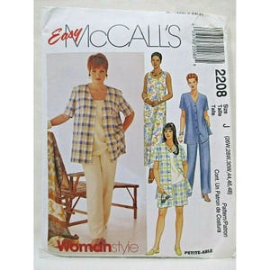 May include: An Easy McCall's sewing pattern envelope 2208, size J, featuring illustrations of clothing sets including a plaid jacket, solid top, and pants, a floral print sleeveless dress, and a plaid shirt with matching shorts, with text and barcode.