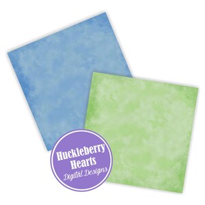 May include: Two digital paper backgrounds, one light blue and one light green, with a faded watercolor effect. The papers are square and have a subtle texture. The text "Huckleberry Hearts Digital Designs" is in a purple circle.