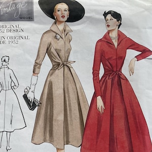 May include: Vintage sewing pattern for a dress with a fitted bodice and a full skirt. The pattern is from 1952 and includes instructions for making a beige and a red dress. The pattern number is 2401.