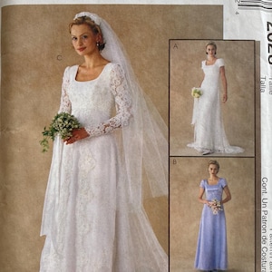 May include: A McCall's sewing pattern envelope featuring a bride in a white lace wedding dress with long sleeves and a veil. The envelope also shows two other dress styles. The text "McCall's" is at the top.
