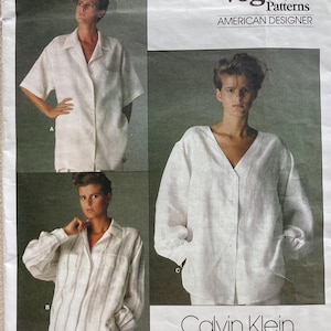 May include: Vogue Patterns American Designer sewing pattern featuring Calvin Klein designs. The pattern includes images of a white short-sleeved shirt, a white long-sleeved shirt, and a striped long-sleeved shirt. The pattern number is 1509.