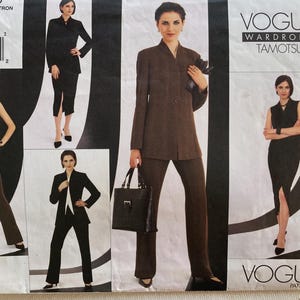 May include: Vogue Wardrobe Tamotsu sewing pattern featuring a variety of women's suit designs. The pattern includes options for a blazer, pants, skirt, and vest. The cover displays images of the finished garments in black and brown.