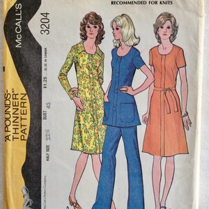 May include: Vintage McCall's sewing pattern envelope featuring illustrations of three women in 1970s fashions. The envelope is labeled "Easy Knits" and includes text such as "A Pounds-Thinner Pattern" and "Half Size Dress or Tunic and Pants."