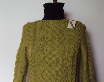 Hand made sweater with nice twists, 3/4 sleeves and loose neck. Hand knitted from pure new wool superwash. FruStrik from Denmark. Size M