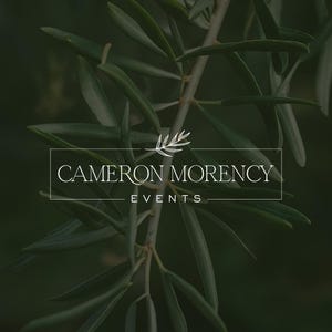 Cameron Morency Events custom logo design — refined white serif wordmark in a thin rectangle frame with botanical leaf sprig icon on dark foliage background. Event planning brand logo by 90Designs.