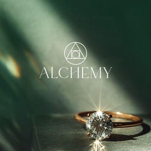 Alchemy custom logo design — minimalist geometric triangle and circle icon with elegant serif wordmark on a deep green jewellery background. Luxury jewellery or wellness brand logo by 90Designs.