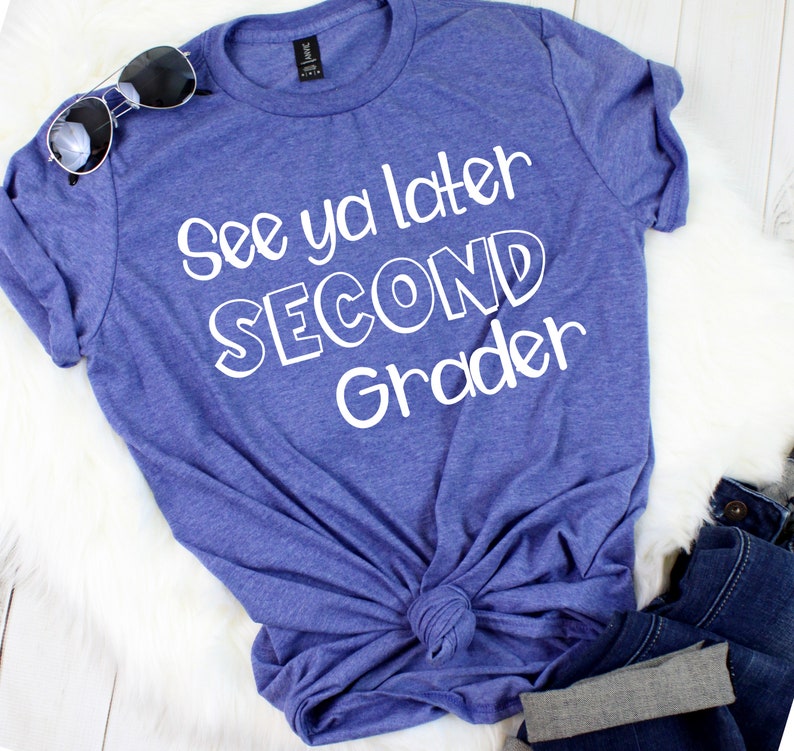 May include: A blue t-shirt with the text "See ya later Second Grader" in white lettering.