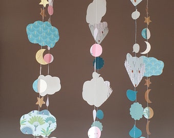 Wooden mobile with garlands of foxes and clouds for children's room