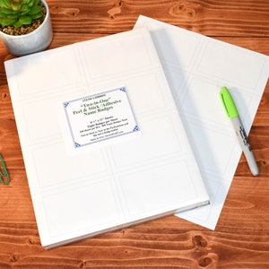 May include: Two sheets of white adhesive name badges. Each sheet has eight 3 x 1.125 inch name badges. The text on the sheet reads "Two-in-One" Peel & Stick/Adhesive Name Badges. Eight Badges per Sheet. 100 Sheets per Box. 800 Name Badges Total. Peel & Stick. Tear at the Perforations and Stay True to the Badge Folder. Made in the USA.  StickerGiant.com