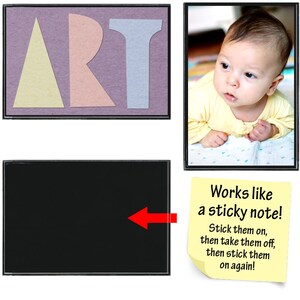 May include: A black framed corkboard with the word "ART" spelled out in colorful paper letters. The corkboard is attached to a white wall. A yellow sticky note with the text "Works like a sticky note! Stick them on, then take them off, then stick them on again!" is attached to the wall below the corkboard. A black framed photo of a baby lying on its stomach is attached to the wall to the right of the corkboard.
