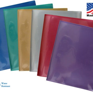 May include: A set of six clear plastic folders in various colors, including blue, green, gold, silver, red, and purple. The folders are water-resistant and made in the USA.