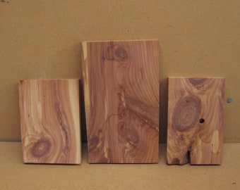 3 smaller to medium cedar boards, with very pretty knots and grain lines