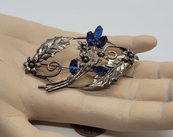 Vintage Sterling Silver Open Design Floral Brooch with Blue Rhinestones