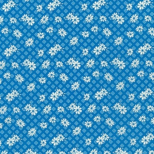 May include: A blue fabric with a white floral pattern. The pattern is a repeating design of small white flowers with a diamond pattern in the background.