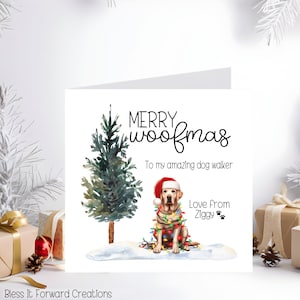 May include: A Christmas card with a watercolor illustration of a yellow Labrador wearing a Santa hat and Christmas lights. The card reads "MERRY woofmas" and "To my amazing dog walker".