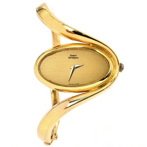 Girard Perragaux 1980s 18K Gold Oval Dial Bangle Watch