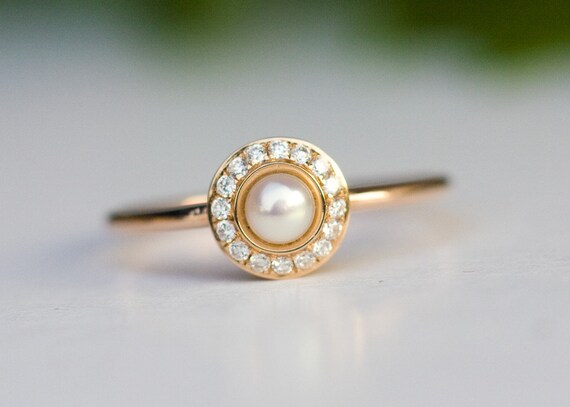 Engagement ring with diamond and pearl deals