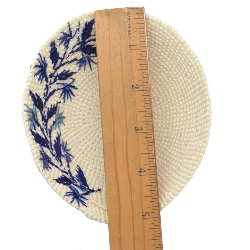 A ruler shows that the kippa is almost 5-1/2 inches wide.