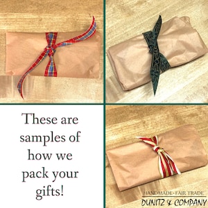Assorted packets wrapped in light brown kraft tissue paper and various ribbons. This is how we package our jewelry.