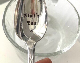 May include: A silver teaspoon with the words "Mimi's Tea" engraved on the bowl. A small heart is engraved below the text.