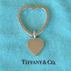 Louis Vuitton Astronaut Keychain  Tiffany heart, Keychain, Heart charm  bracelet