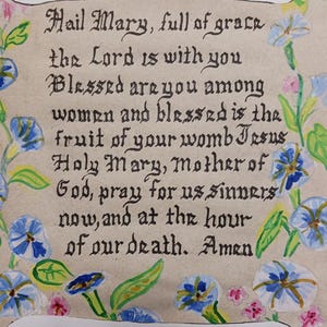 The &quot;Hail Mary&quot; with flowers and a banner