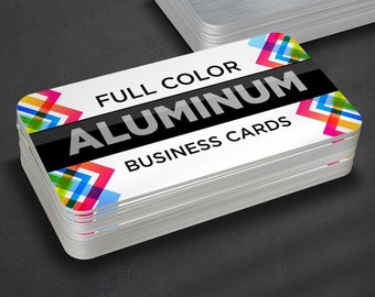 May include: A stack of full color aluminum business cards with a colorful geometric design and the text "FULL COLOR ALUMINUM BUSINESS CARDS".