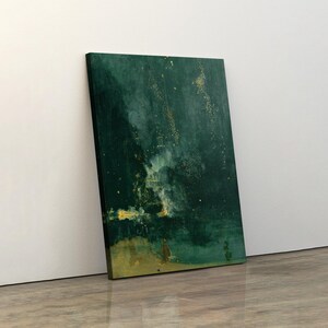May include: An abstract canvas print featuring a dark teal and gold color palette. The artwork has a textured appearance with gold flecks and brushstrokes. The canvas is leaning against a white wall on a wooden floor.