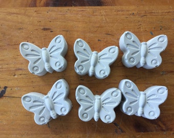 A set of 9 solid concrete butterflies-natural