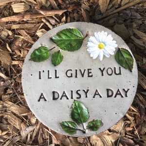 9 in. Round solid concrete daisy stepping stone/garden stone