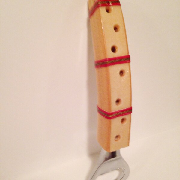 Bottle opener made from a vintage tennis racquet