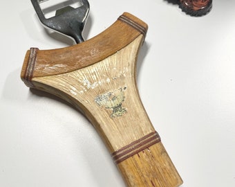 Bottle opener made from a vintage tennis racquet