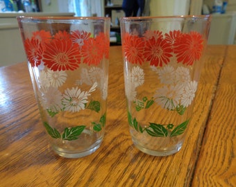 White and Green Daisy pattern Swanky Swigs Juice Cups with a Red 3 12 tall.