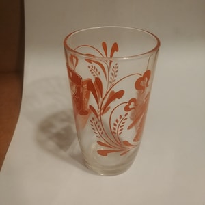 Mid-Century Vintage Swanky Swig 3-3/4&quot; Juice Glass with Cradle and Churn. Strong Orange Graphics. No Damage or Cloudiness. INV#1540