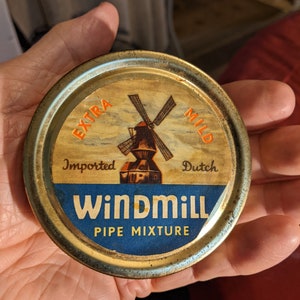 Mid-Century Windmill Pipe Mixture Tobacco. 3-5/16&quot; Dia. Undamaged. Appropriate Oxidation of Tin. Intact Original Back Label. INV#1205i