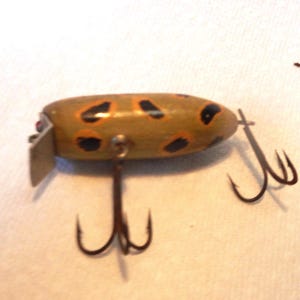 Vintage Wood Surface Fishing Lure, Green with Black & Gold Markings.