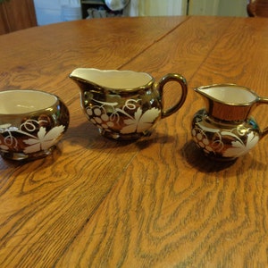 Circa 1949 Gray's Sandland Copper Lustre Pottery 3 pc set: creamer, open sugar and mini-pitcher.