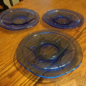 3 Hazel Atlas Cobalt Blue 5-5/8" Royal Lace Saucers. Very Light Interior Rim Roughness, None on outer Rim. No Discernable Chips. INV#0712