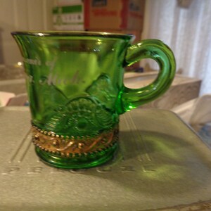 Circa 1905 Emerald Green Lacy Medallion Souvenir 2-3/8&quot; Mug, Reading, Michigan. Nice Undamaged Condition. Good Graphics and Gold. INV1060