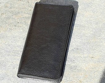 Entirely handmade leather mobile phone case with pocket for banknotes, credit cards and receipts.
