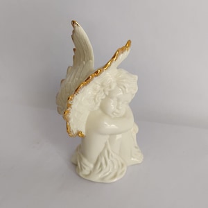 Vintage Porcelain Cherub Figurine: Gold Wings, Sleeping Angel