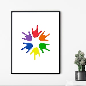 May include: A colorful print of seven rainbow-colored handprints in a circle, each hand is making the 'I love you' sign language gesture.