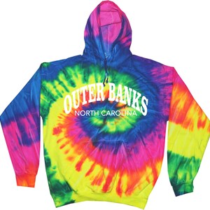 May include: A tie-dye hoodie with the text "Outer Banks North Carolina" in white. The hoodie features a spiral pattern of blue, green, yellow, pink, and purple. It has a hood and long sleeves.